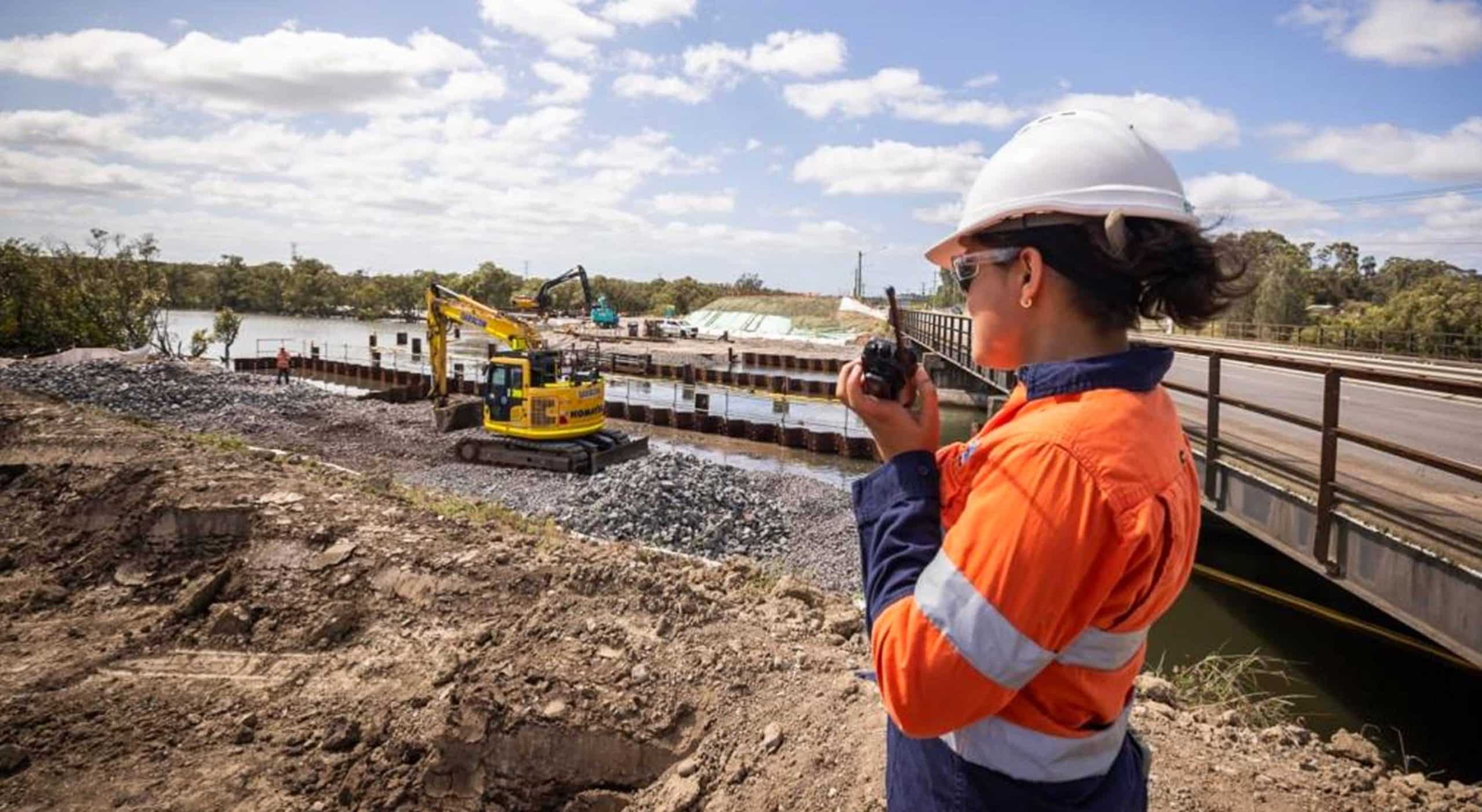 Worker using two-way radio at Australian infrastructure project